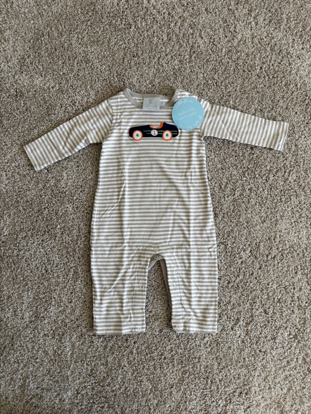 Little English Beige and White Striped Baby One-Piece with Race Car Applique